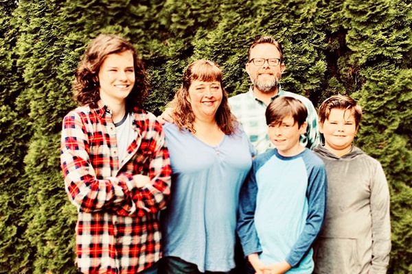 Photo of Jennifer and her family posing outdoors